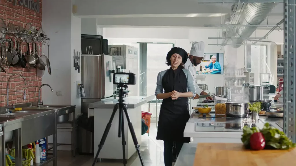 professional chef teaching a virtual cooking class to a group of employees working remotely