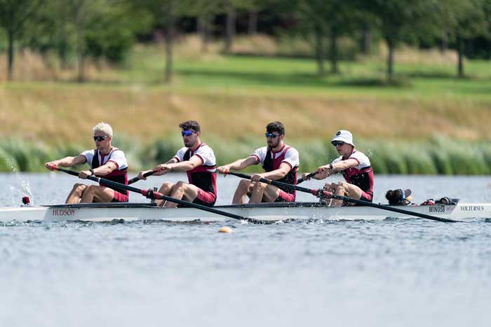 Four atheles on a rowing competition organized with Timely event software