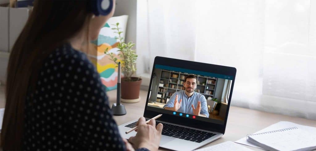 woman and man meeting for a one o one employee training through an online training platform