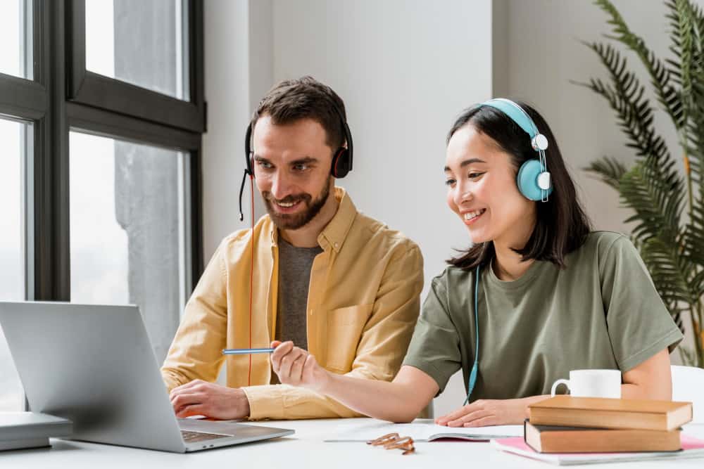 man and woman receiving training through Timely online learning platform