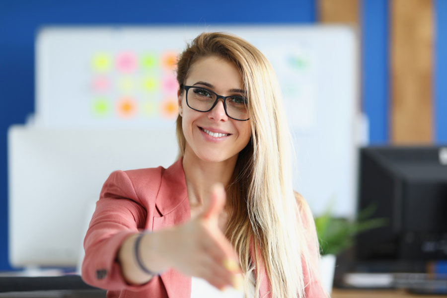 professional woman standing hand to close a deal with a sponsor of event