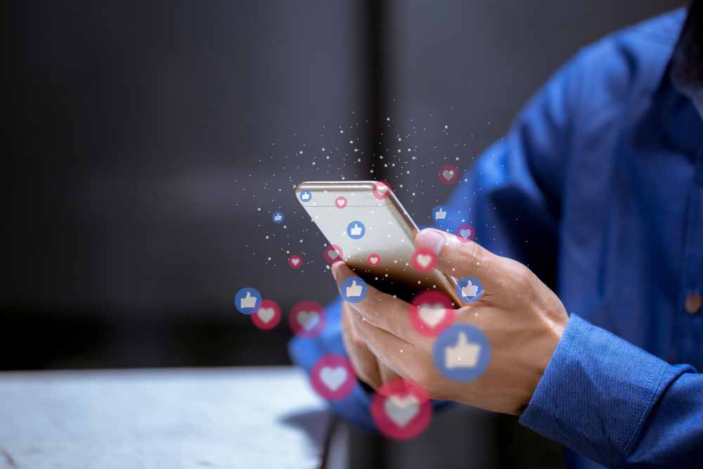 person holding a mobile phone and sharing the new online events calendar with others