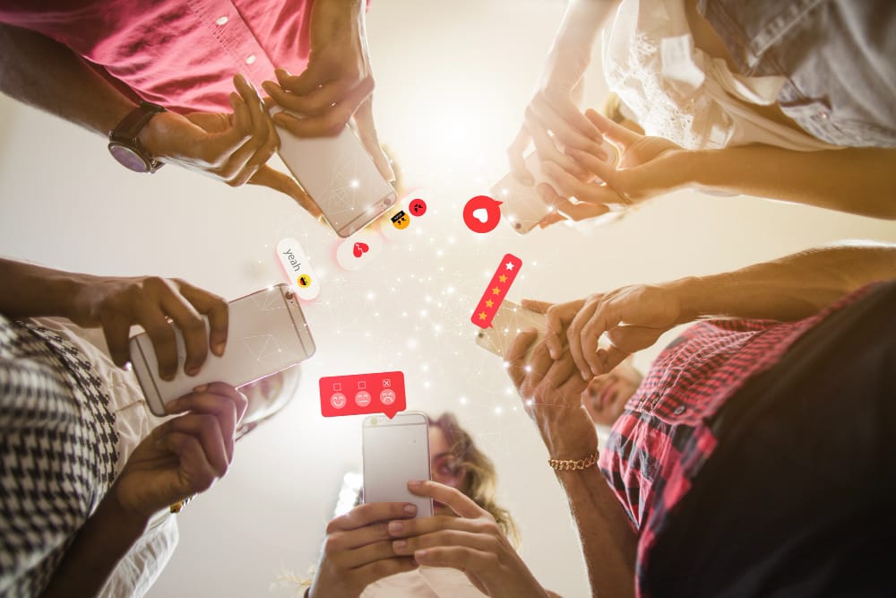 group of people looking at their mobile phones and social media networks