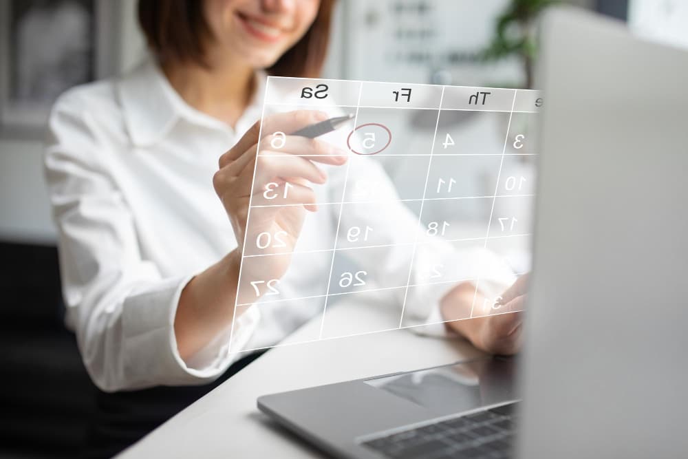 A professional woman making event inquiries for a specific calendar date.