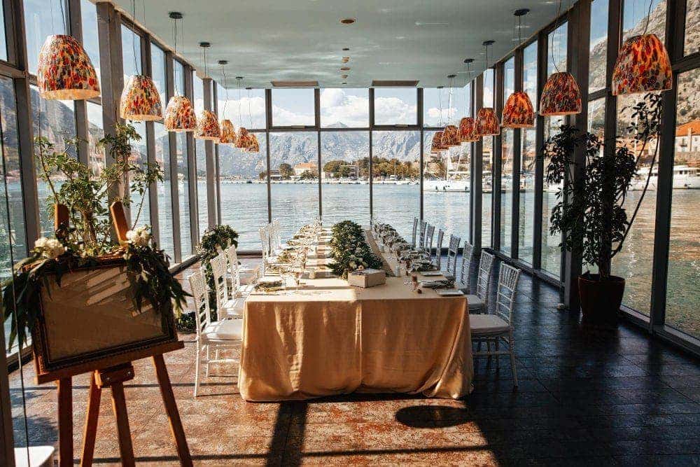 A beautiful venue for a wedding reception, by a lake.