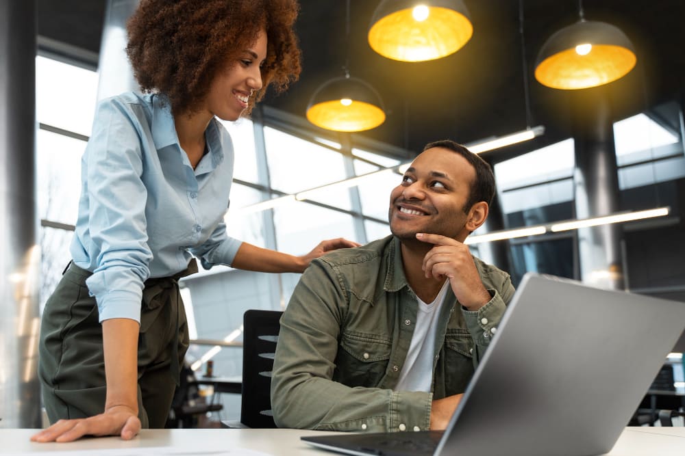 two colleagues having a conversation during work.