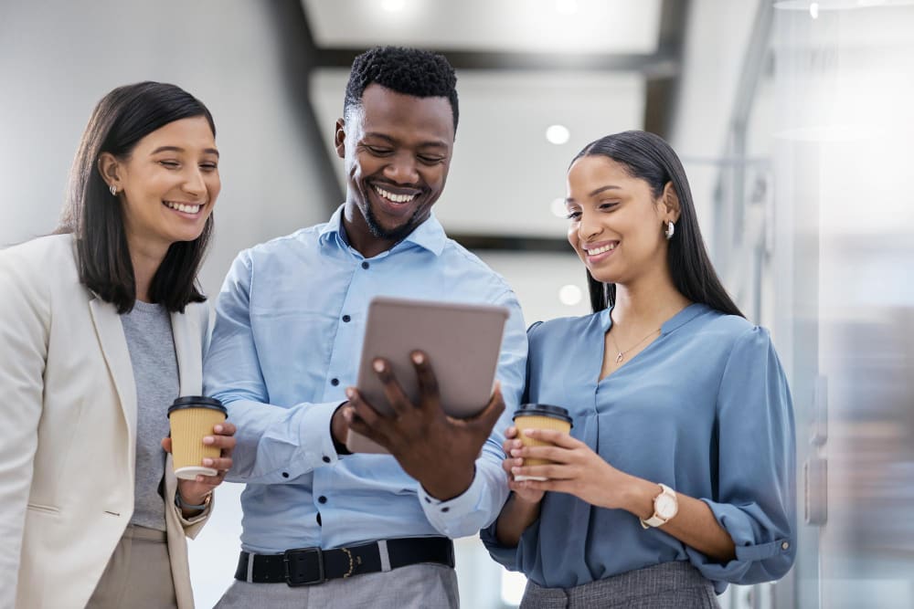 a group of mixed race young event professionals smiling ang working together.