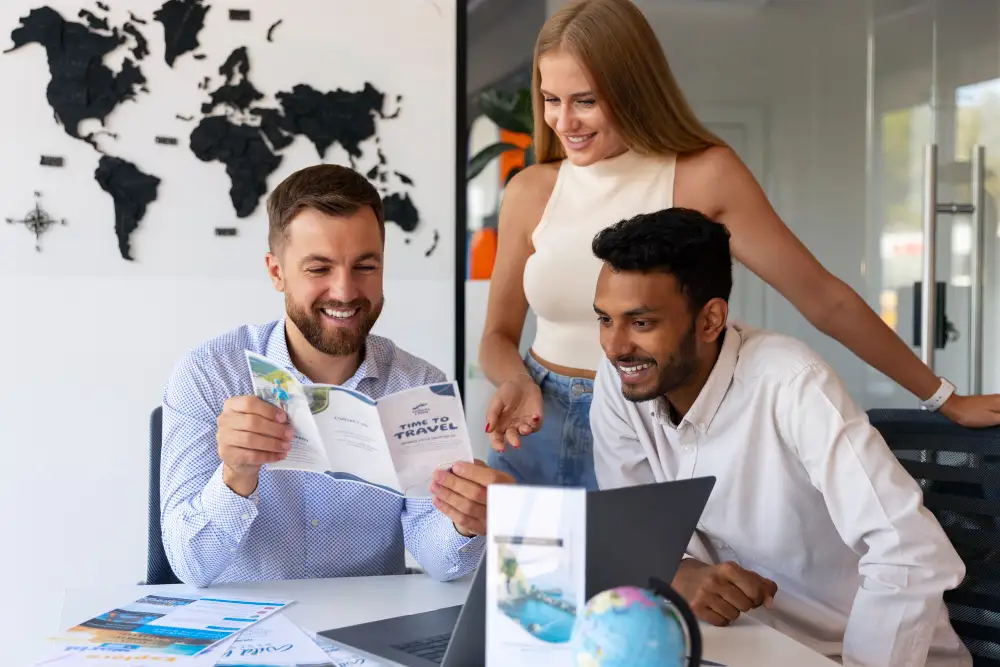 A couple and a travel agent showcasing how tourism attractiveness impacts destination marketing.