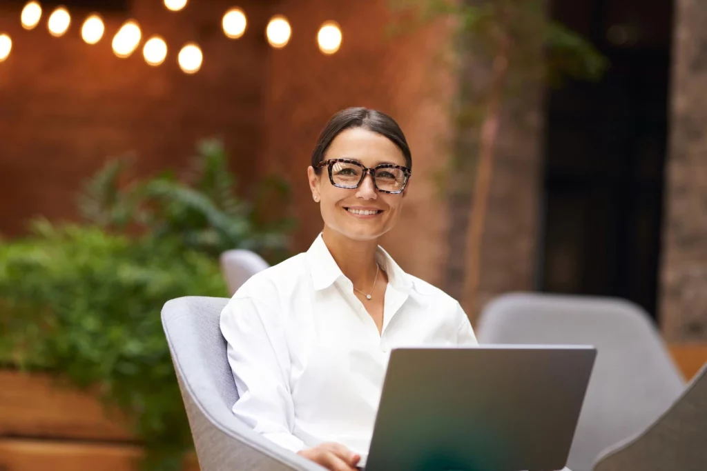 A confident Event planner working with Timely software after setting her event planner rates.
